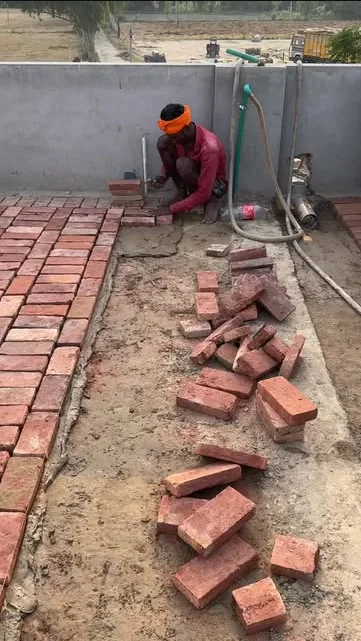 Brickwork in progress at a house construction site in Punjab